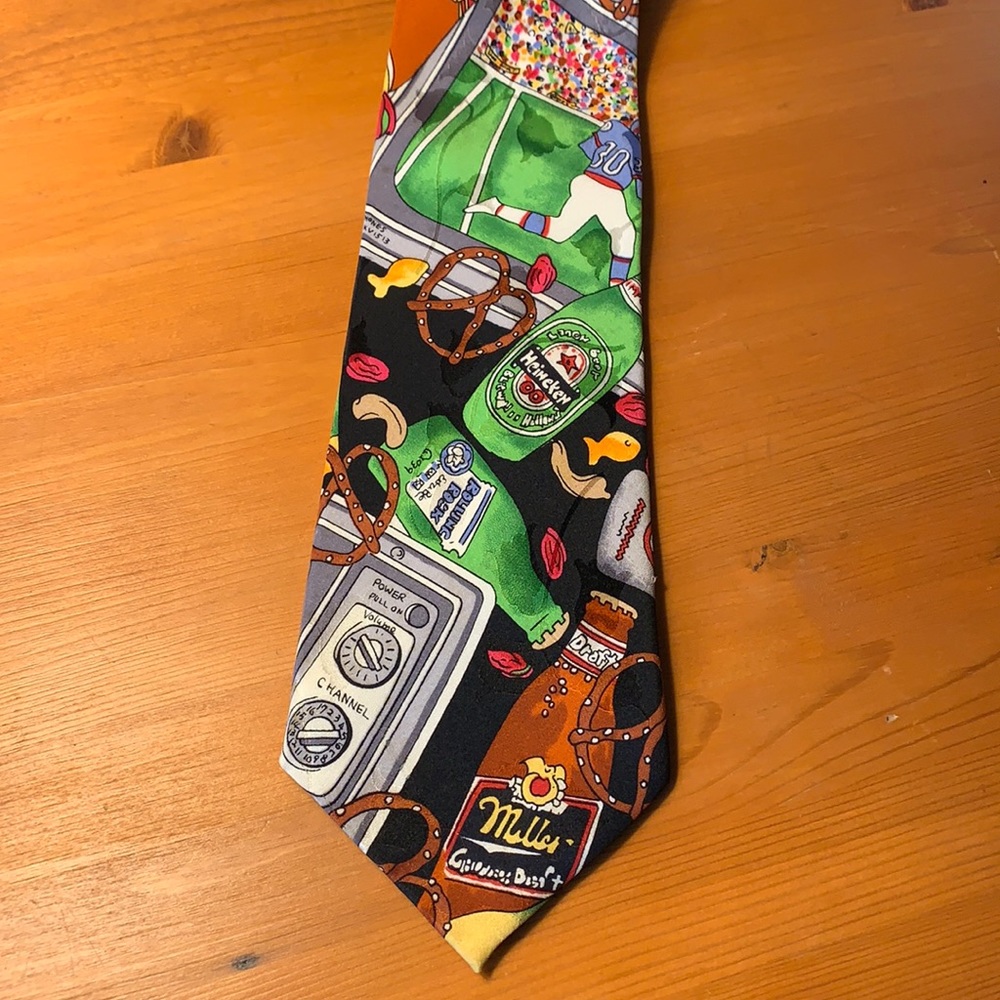 Vintage Nicole Miller silk tie. Novelty Football and snack motif. Like new.